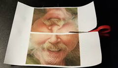 Image showing printed selfies being trimmed